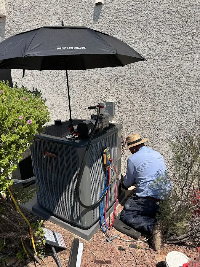HVAC technician performing outdoor AC maintenance in Pennsville